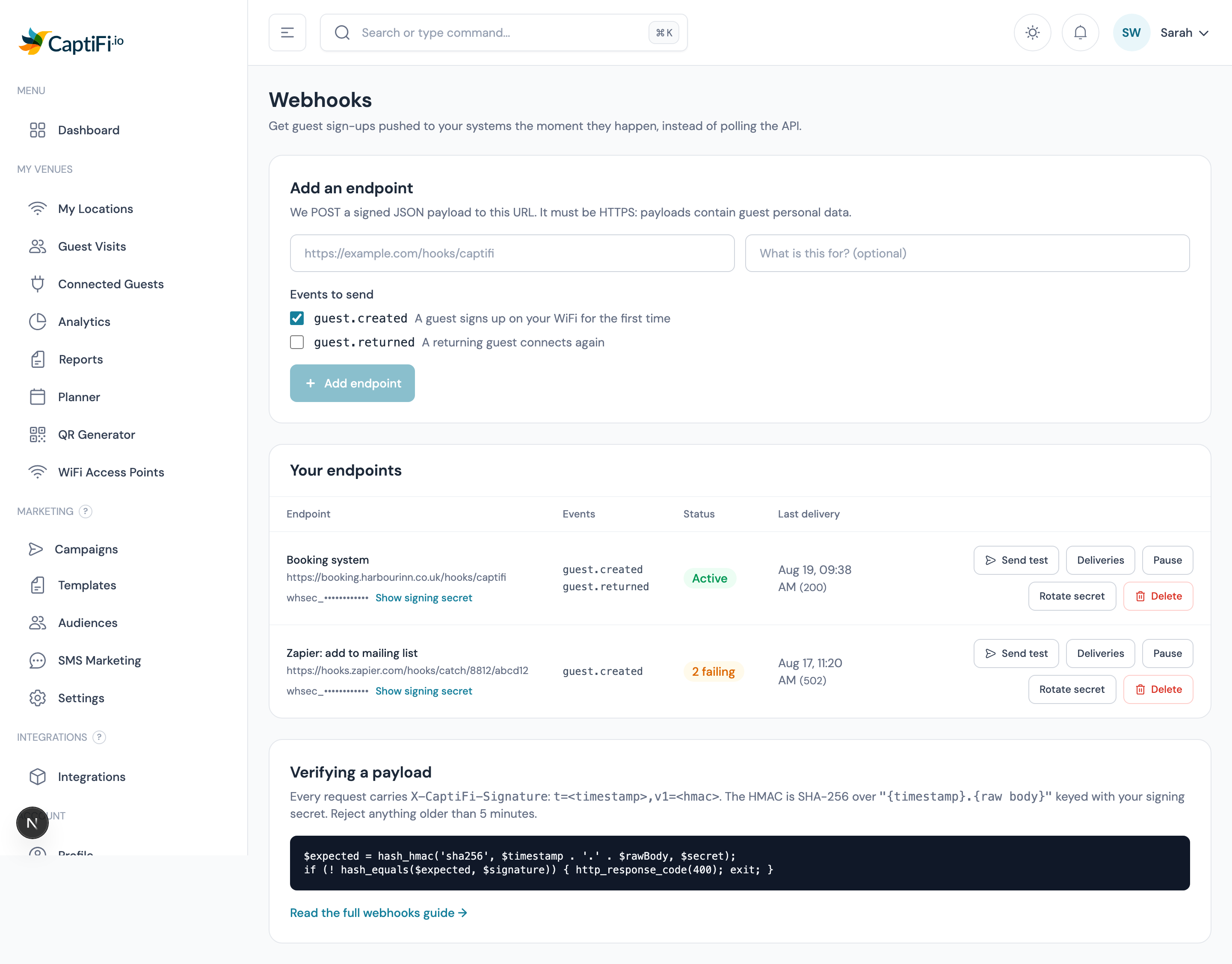 The Webhooks page listing an endpoint with its events, status and signing secret, plus the recent delivery log