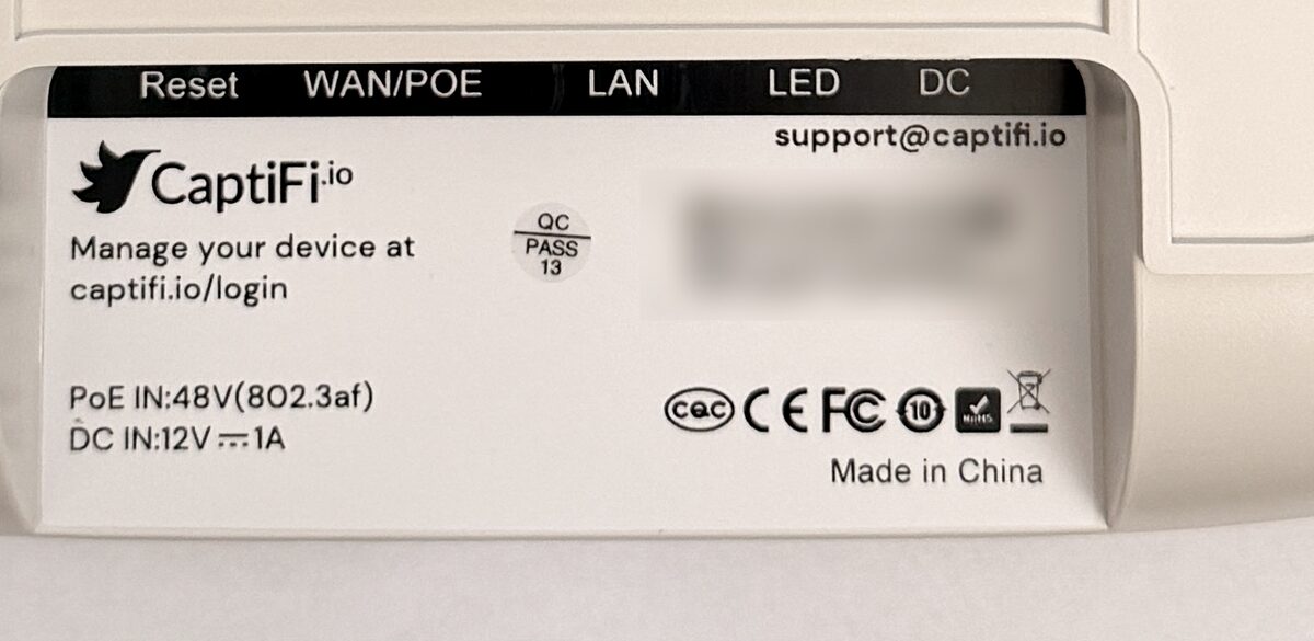The label on the underside of the device, showing the Reset, WAN/POE, LAN, LED and DC sockets