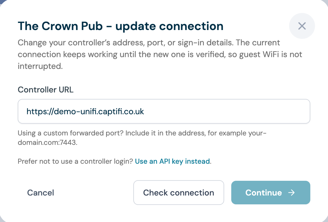 The CaptiFi update connection panel with the controller URL field, a note about custom forwarded ports, and a link to use an API key instead
